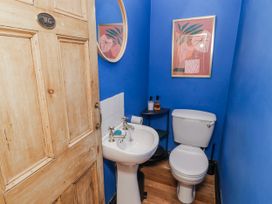 A bathroom with a sink and toilet at The Secret Garden in Narberth