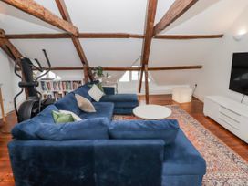 A living room with a sofa and coffee table at The Secret Garden in Narberth
