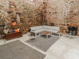 A seating area with a sofa and coffee table at The Secret Garden in Narberth