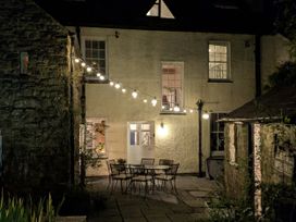 An outdoor area with seating and lights at The Secret Garden in Narberth