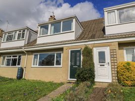 A house with garden and pathway at 11 Berry Close in Painswick
