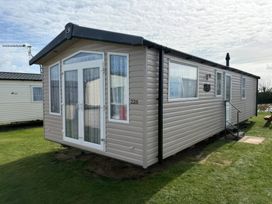A caravan with steps and windows at Harlyn Hideaway (Swift Barritz) Padstow