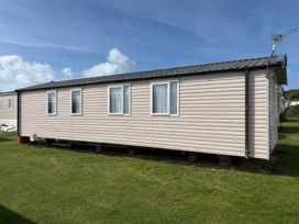 A mobile home with windows and a satellite dish at Harlyn Hideaway (Swift Barritz) Padstow