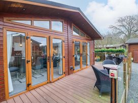 An outdoor area with decking and seating at Waters Edge Lodge in Windermere
