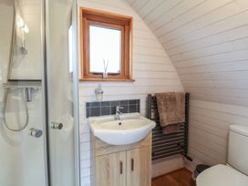 A bathroom with a shower, sink, and toilet at Vine View near Halesworth