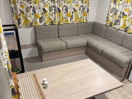 A living room with a sofa and coffee table at N5 Ilfracombe