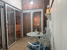 A dining area with a table and chairs at York Cottage Southwold