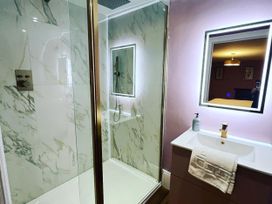 A bathroom with a shower and sink at Picton House near St Clears
