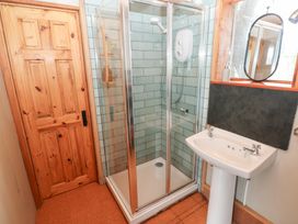 A bathroom with a shower and sink at Cabin in Newport