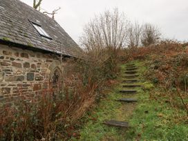 An outdoor area with a building and steps at Cabin in Newport