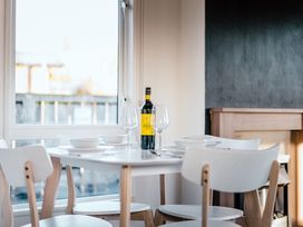 A dining room with a table set for a meal at Spruce Waterside Spa (Pet) Thirsk