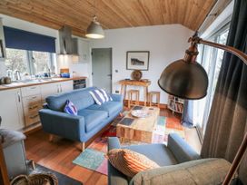 A living room with a sofa and coffee table at The Faithfuls Cabin in Dingle