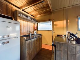 A kitchen with a refrigerator and sink at Kruger (Pet) Penrith