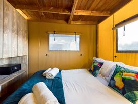 A bedroom with a bed and pillows at Kruger (Pet) Penrith