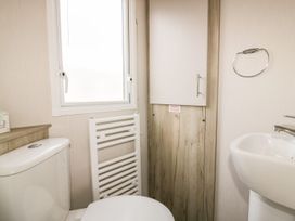 A bathroom with a toilet and sink at Barney's Retreat in Newquay