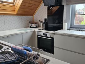 A kitchen with a sink and cabinets at Kinder Lodge 3 Portreath