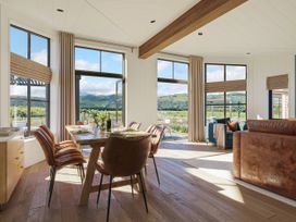 A dining room with a table and chairs at Wansfell (Pet) in Penrith