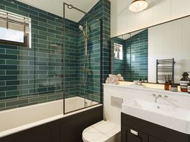 A bathroom with a bathtub and shower at Wansfell (Pet) Penrith