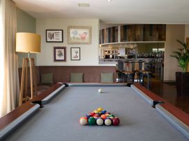 A game room with a pool table and bar area at Wansfell (Pet) in Penrith