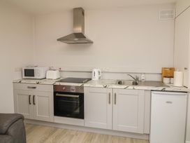 A kitchenette with appliances and basic fixtures at Radharc an Hook @ Estuary Bliss