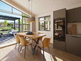 A dining room with a table and chairs at Lonscale (Pet) Penrith