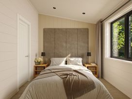 A bedroom with a bed and bedside tables at Lonscale (Pet) Penrith