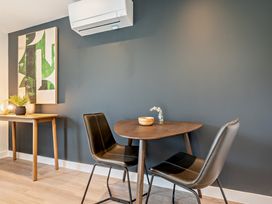 A dining room with a table and chairs at Arvor Wetroom Studio 1.0 