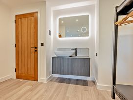 A bathroom with a sink and mirror at Arvor Wetroom Studio 1.0