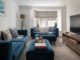 A living room with a sofa and coffee table at Tides Door in Dartmouth