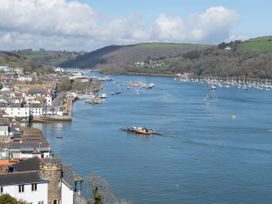 A view of a river with boats and houses at Tides Door in Dartmouth