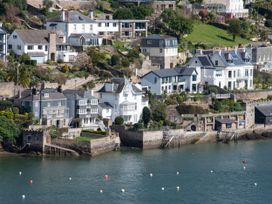 A row of houses beside the water at Tides Door in Dartmouth