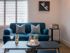 A living room with a sofa and a coffee table at 28 Piazza in St Ives