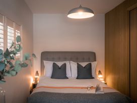 A bedroom with a bed and decorative items at 28 Piazza St Ives