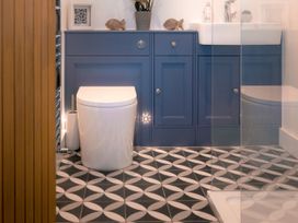 A bathroom with a toilet and sink at 28 Piazza St Ives