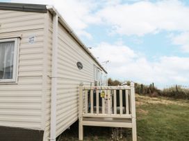 A caravan exterior with a deck and steps at 37 in Redcar