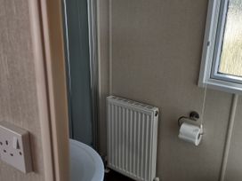 A bathroom with a sink and shower at Sands Retreat in Redcar