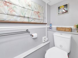 A bathroom with a toilet and a towel rack at Oldfields