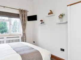 A bedroom with a bed and television at Oldfields