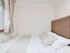 A bedroom with a bed and pillows at Oldfields