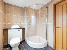 A bathroom with a shower and toilet at Oldfields