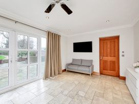 A living room with a sofa and television at Oldfields
