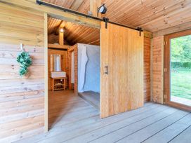 A bathroom with a wooden door and sink at Oldfields