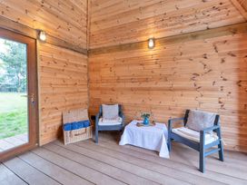 A seating area with two chairs and a table at Oldfields