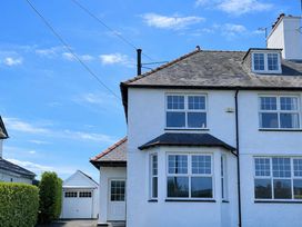 A house with a garage and windows at Bryniau in Morfa Nefyn
