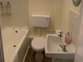 A bathroom with a bathtub, toilet, and sink at 187 Atlantic Bays Tregolds