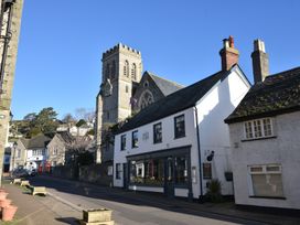 A street view featuring a church and buildings at Devona in Beer