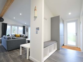 A living room with a sofa and coffee table at 20 Meadow Retreat in Dobwalls