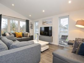 A living room with a sofa and television at 20 Meadow Retreat in Dobwalls