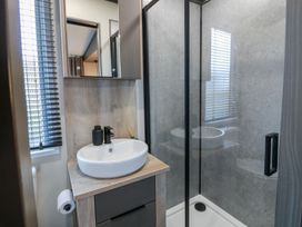 A bathroom with a sink and a shower at Willow's Way in Stranraer