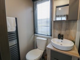 A bathroom with a toilet and sink at Willow's Way in Stranraer